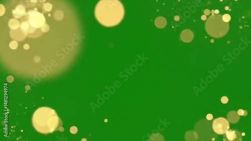 Gold bokeh lights shimmering and floating on a green screen background animation effect