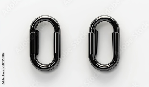 Two polished black oval-shaped metal links, positioned horizontally, against a white background.  They appear to be connector components,  designed for attaching or joining other pieces
