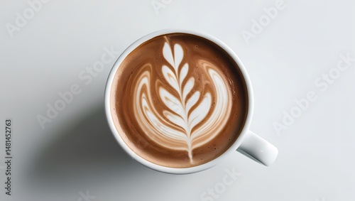 A coffee cup on a brown wooden table with cappuccino foam and heart art