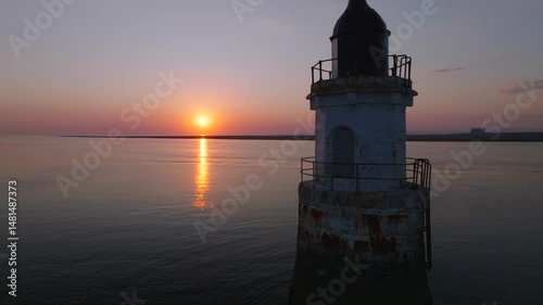 Wallpaper Mural Old lighthouse in very calm waters at sunset. Close up. Plover Scar Lighthouse, Lancashire, UK. Torontodigital.ca