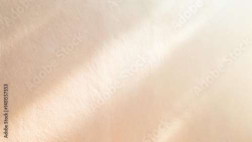 自然光が差し込むベージュの壁　美容　コスメ系背景テクスチャ
