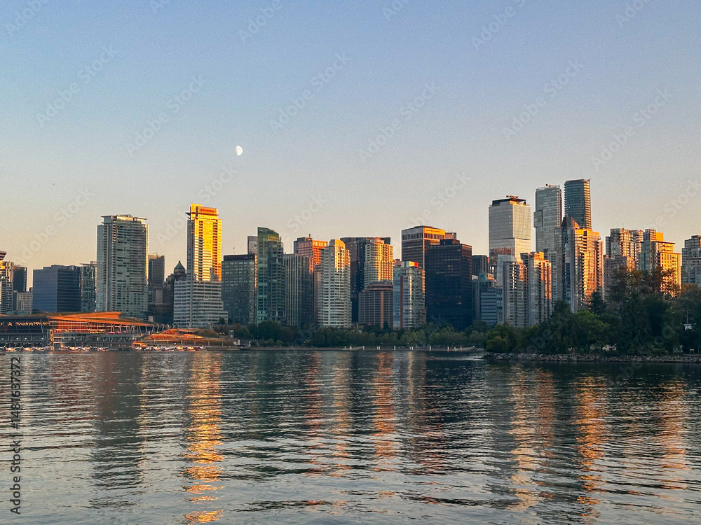 Fototapeta premium Reflections over coal harbour on a summer evening in Vancouver