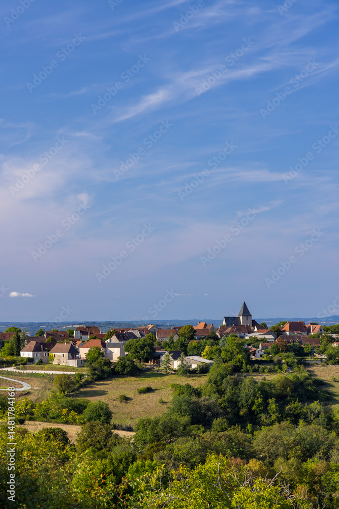 Obraz premium French village of Reilhaguet in Lot department under blue sky with cirrus clouds
