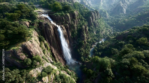 Experience the power of a roaring monsoon waterfall cascading down a lush cliff in a breathtaking natural landscape