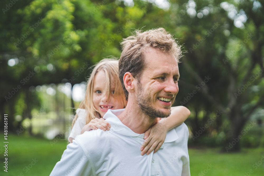 Fototapeta premium Happy family parent children having picnic outdoor activity. Enjoy happiness moment summer playing together including father mother son and daughter relaxing in the morning sunrise.