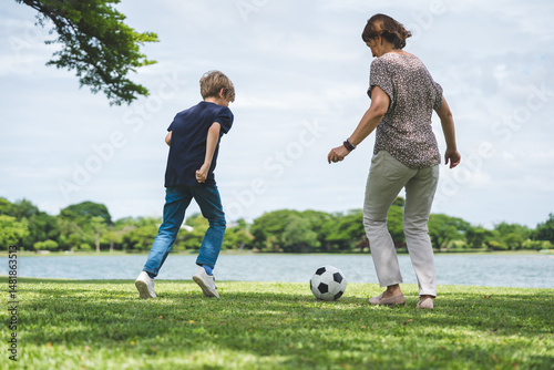 Happy family parent children having picnic outdoor activity. Enjoy happiness moment summer playing together including father mother son and daughter relaxing in the morning sunrise.
