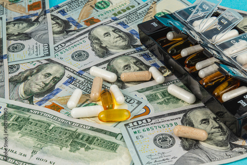 Money and supplements arranged together on a textured surface