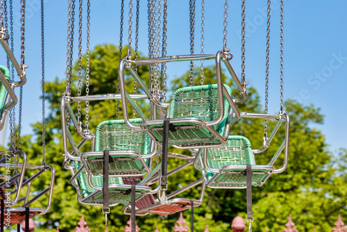 Colorful Swing Carousel Chairs Against Blue Sky – Amusement Park Ride Background