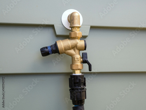 Hot Water Cylinder Tap with Pressure Regulator and Backflow Valve Mounted on Wall