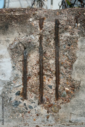 Фотография Broken concrete revealing reinforcement steel – urban decay detail