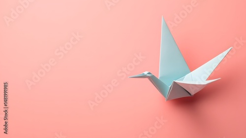 Elegant Light Blue Origami Crane in Clean Studio for Symbolic and Artistic Visuals