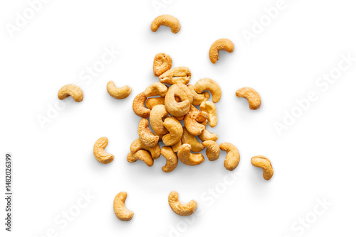 Pile roasted organic cashew isolated on a transparent background with shadow, top view, png