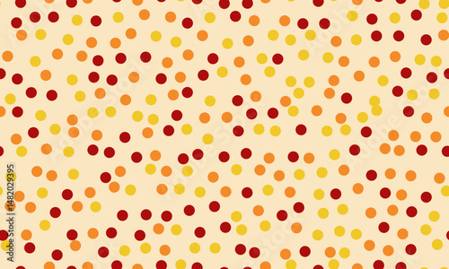 Abstract autumnal pattern. Warmtoned dots on a cream background create a cheerful, festive design. Perfect for fallthemed projects, websites, and social media.