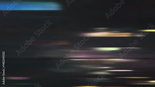Colorful horizontal lines moving rapidly across a dark background. Dynamic and vibrant abstract animation. A high-energy backdrop for music videos or digital art projects.