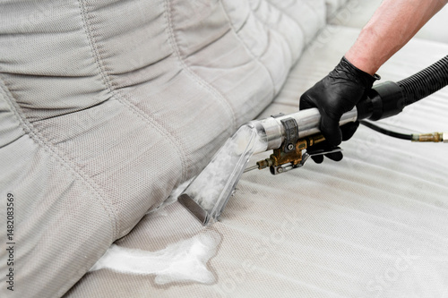 Professional upholstery cleaning service in action at residential home during daylight hours