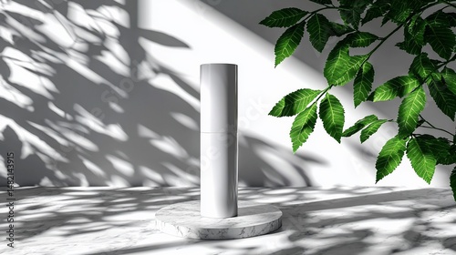 White cylinder product display with natural light and shadows