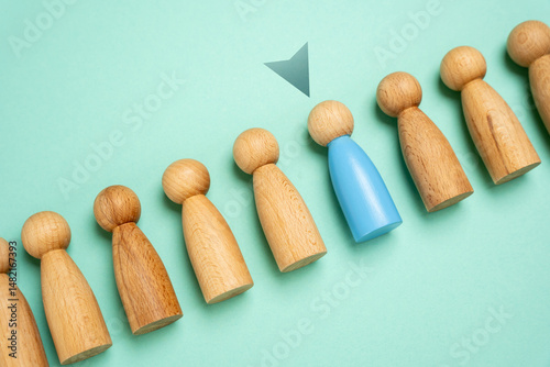 Select a person from a sample group. Suitable candidate. Hiring. Recruiting for service. Promotion at work. Career development. Finding the most suitable individual for the role or service.
