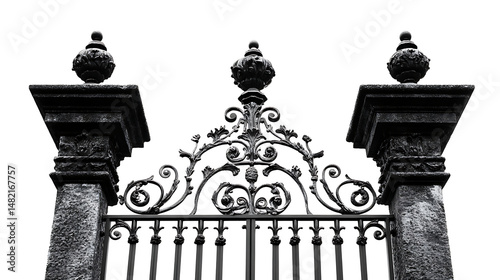 Close up of an ornate black iron gate with a concrete pillar against a white background.