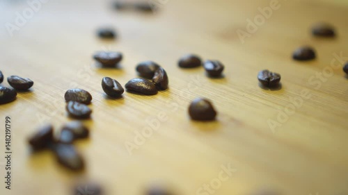 Roasted coffee beans on a wooden surface