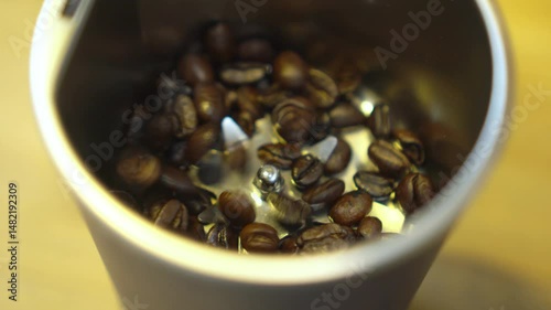 A close-up of freshly roasted coffee beans in a cup.