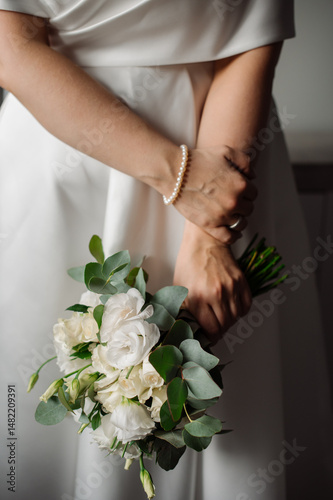Wedding day. Bride holding a beautiful bouquet