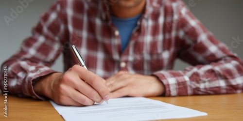 College student reviewing housing contract at desk