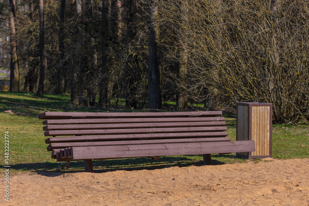Wooden benches and chaise lounges for rest on the streets of the city and in the park, public places Wooden benches and chaise lounges for rest on the streets of the city and in the park, public places