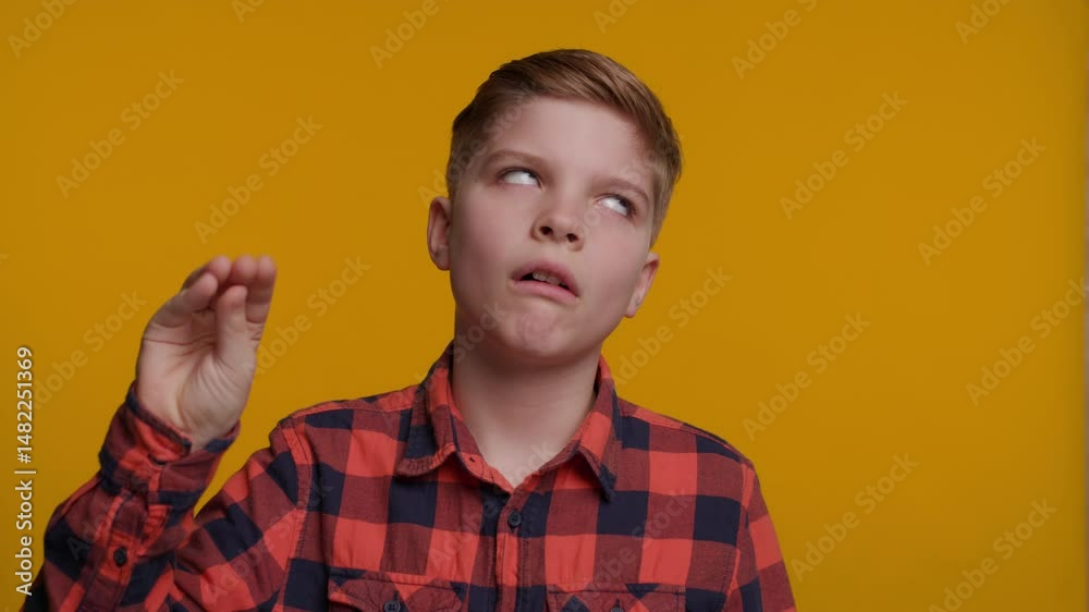Boy Makes a 'Bla Bla' Gesture with his Hand near his Face, Expressing Boredom or Sarcasm
