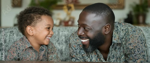 Father and son sharing a smile.