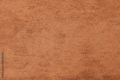 Structure of orange suede fabric with abstract shabby texture with embossed shades closeup, macro. Upholstery, decorative cloth structure, canvas for home decor. Background, backdrop, wallpaper.