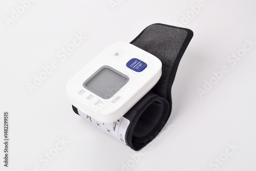 Digital wrist blood pressure monitor isolated on white background. Health care and check up concept