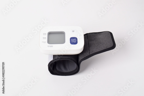 Digital wrist blood pressure monitor isolated on white background. Health care and check up concept