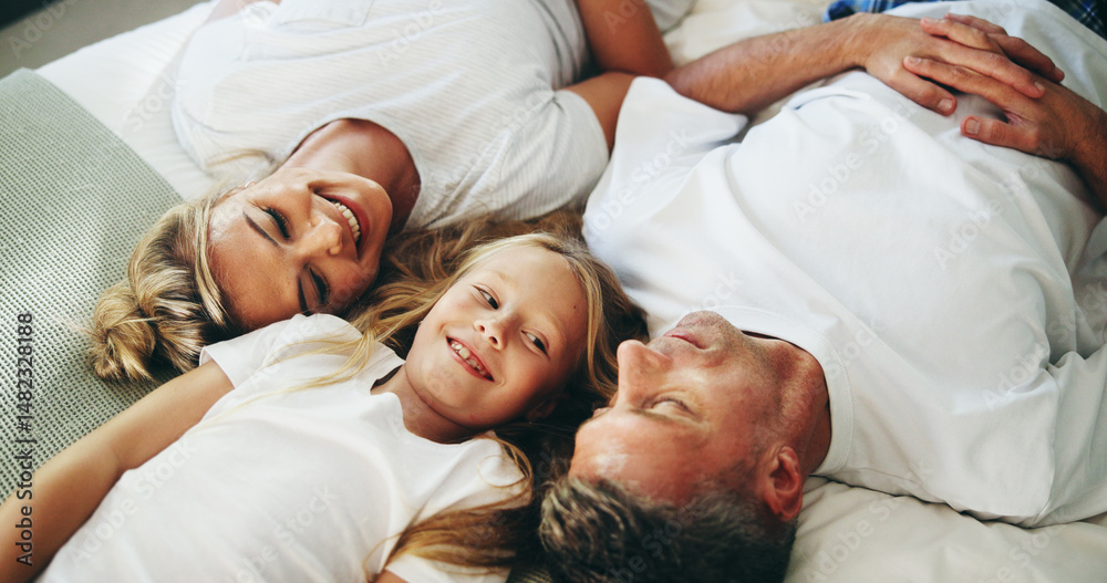 Smile, parents and child relax on bed with love, security and bonding together in bedroom. Happy, people and resting with girl for support, care and family relationship for weekend break at house Smile, parents and child relax on bed with love, security and bonding together in bedroom. Happy, people and resting with girl for support, care and family relationship for weekend break at house