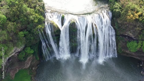 Breathtaking aerial views of Huangguoshu Falls in Guizhou during bright daylight photo