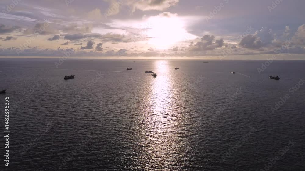 Serene Sunset Horizon with Boats on Tranquil Ocean Waters Serene Sunset Horizon with Boats on Tranquil Ocean Waters