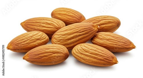 A close-up of freshly harvested almonds arranged on a white background