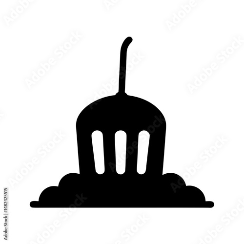 Black silhouette of a ceremonial object or ornament on a stand