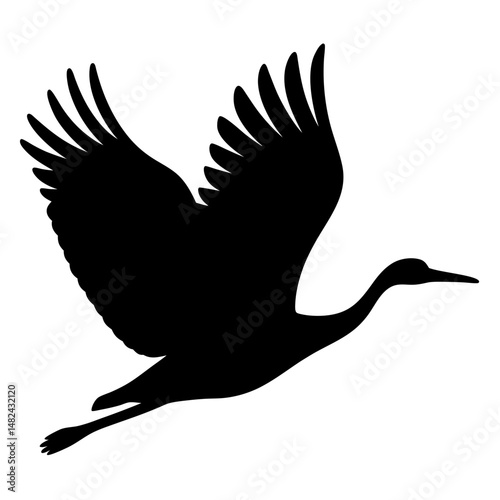 Elegant crane soars through the sky in a striking black silhouette