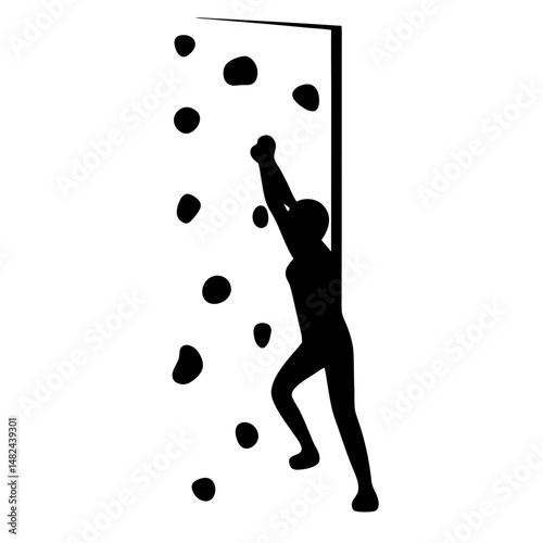 Silhouette of person climbing an indoor rock climbing wall with many grips