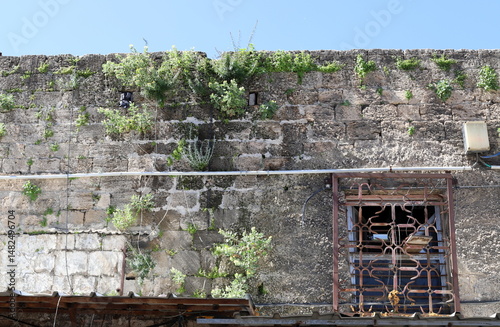 Ruins of old houses in the center of a big city