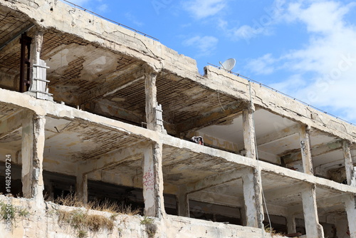 Ruins of old houses in the center of a big city
