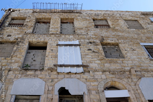 Ruins of old houses in the center of a big city