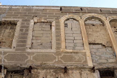 Ruins of old houses in the center of a big city