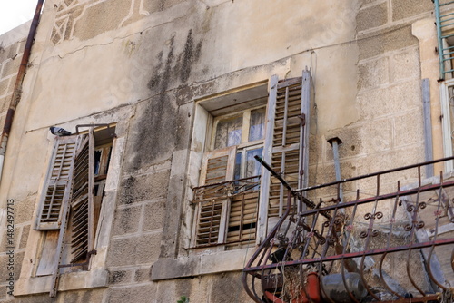 Ruins of old houses in the center of a big city