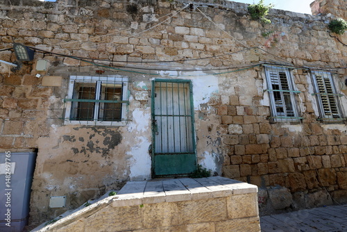 Ruins of old houses in the center of a big city