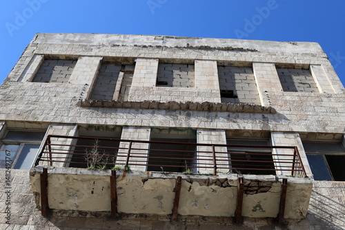Ruins of old houses in the center of a big city