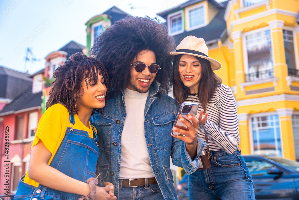 Happy tourists using smartphone and smiling in colorful city street Happy tourists using smartphone and smiling in colorful city street