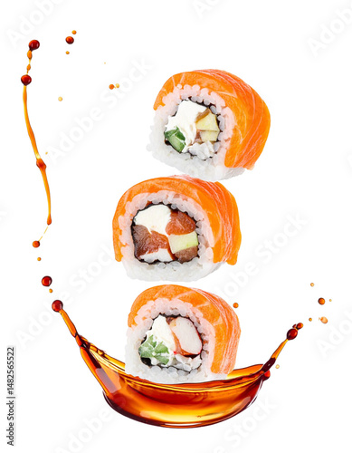 Flying sushi rolls with soy sauce splash isolated on black background