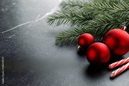 Red Ornaments and Candy Canes on a Dark Surface With Pine Branches for the Ho...