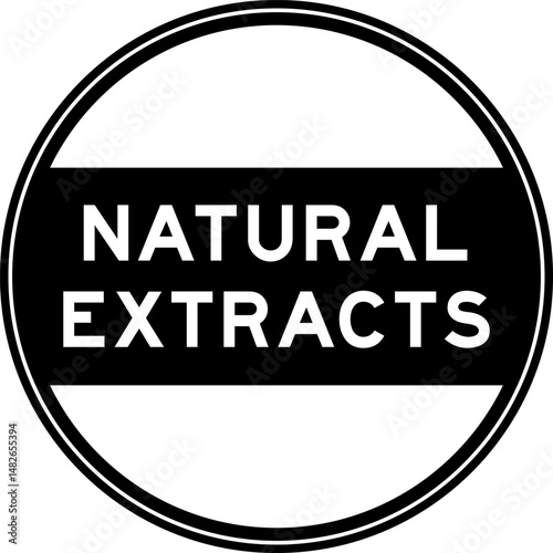 Black color round seal sticker in word natural extracts on white background